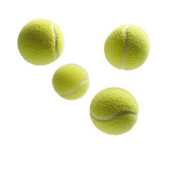Four tennis balls in motion isolated on transparent background