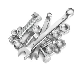 Many metal wrenches, bolts and nuts isolated on white