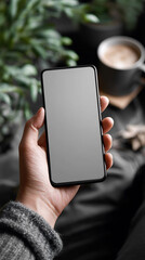 Hand holding blank screen smartphone mockup for app design and website presentation