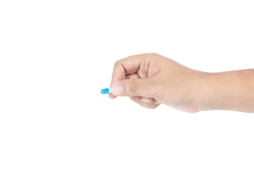 Hand holding a single blue pill capsule. Medicine and healthcare dosage concept. isolated on white background with clipping path.
