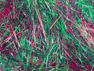 Colorful foil tinsel background, Shimmer shiny green and red tinsel shred festive, wedding, birthday party, Christmas decorations