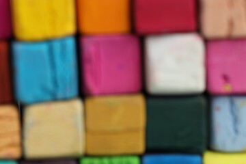 Many colorful chalk pastels as background, closeup