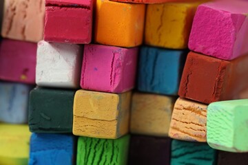Many colorful chalk pastels as background, closeup