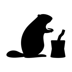Beaver holding food next to a tree stump silhouette