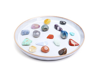 Many different healing stones isolated on white