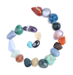 Many different healing stones isolated on white, top view