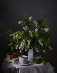 The Serene Still Life features a Book, fragrant Tea, and vibrant Flowers in harmony