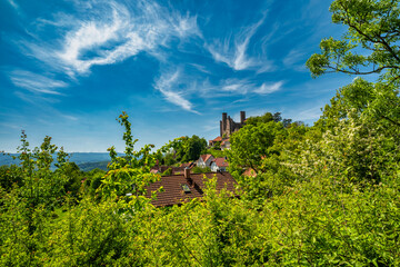 The Majestic and Enigmatic Ruins of an Ancient Castle are Beautifully Surrounded by Lush Greenery