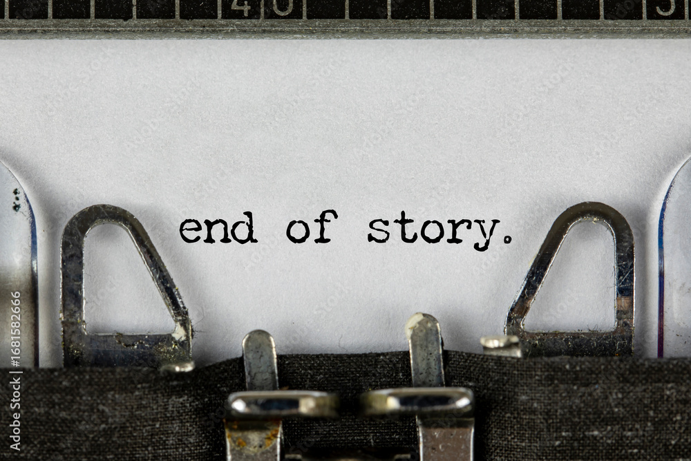 Fototapete closeup of a blue retro typewriter and the text the end written with it in a yellowish foil. close u