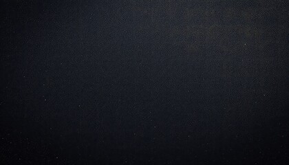 Abstract close up of dark surface showcasing rough textures, a uniform appearance, and subtle variations in light.