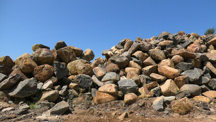 Large rocks piled up at a construction site