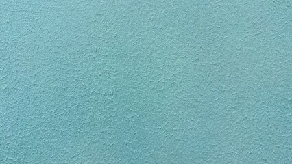 Calm serene aqua blue textured wall surface background providing peaceful tranquility for modern interior design projects