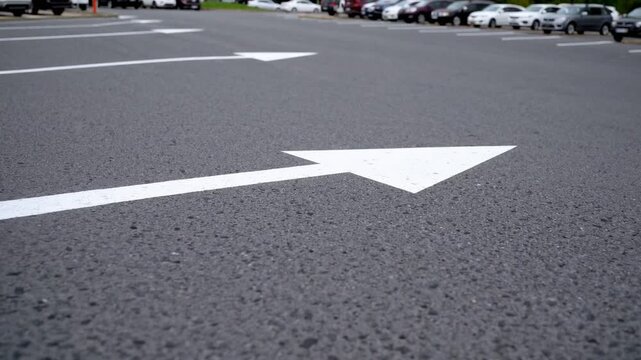 Pale Pointing Arrowhead Indicating Linear Path on Pavement Markings for Vehicular Guidance