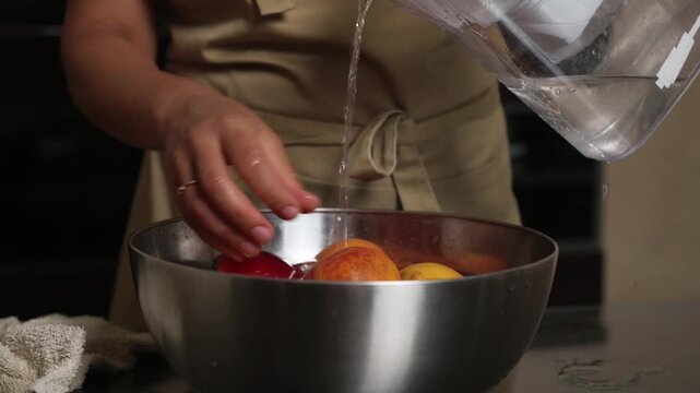 Washing Fresh Fruits in a Kitchen Setting for Healthy Meal Preparation