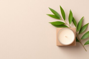Minimalist candle placed on soft background complemented by fres