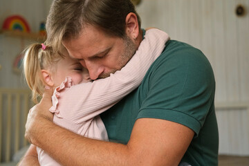 Happy Father Playing with Daughter. Three Years Baby Smiling, Laughing, Looking at Daddy. Man Showing Affection to Child. Candid Real Emotion. Beard Dad and Little Kid Girl. Authentic Family Lifestyle