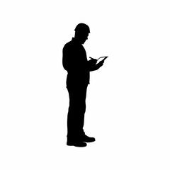 Silhouette of inspector using digital tablet to record results