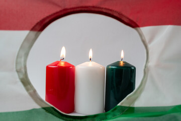 Hungarian flag with burning candles
