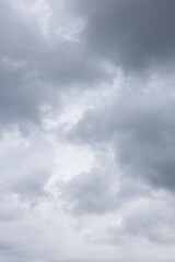 Vertical image of gray and white storm clouds background texture