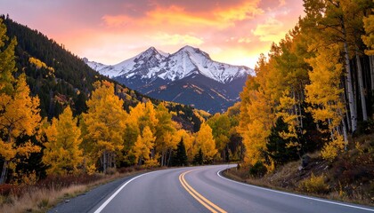 Fototapeta premium Scenic Autumn Mountain Road with Golden Trees and Sunset Sky Landscape Photography 