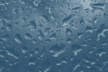 Water Droplets Texture, Macro blue surface with scattered raindrops and condensation for abstract wet backgrounds and design projects