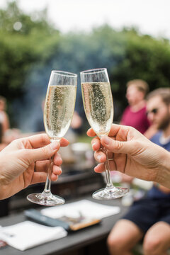 Hand holding glass of champagne, people cheering, friends, party nightclub, wedding, cheering, family, sparkling wine, luxury, 4K, vertical video, social media, 9:16, insta story