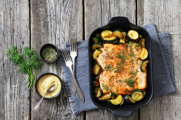freshly baked salmon fillet with zucchini and dill