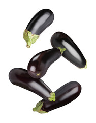 Fresh ripe eggplants falling on white background