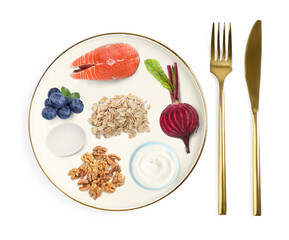 Plate with collection of different foods and cutlery on white background, top view. Healthy eating