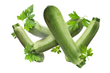 Fresh zucchinis and parsley falling on white background