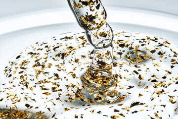 Pipette with 24k gold serum. The texture.