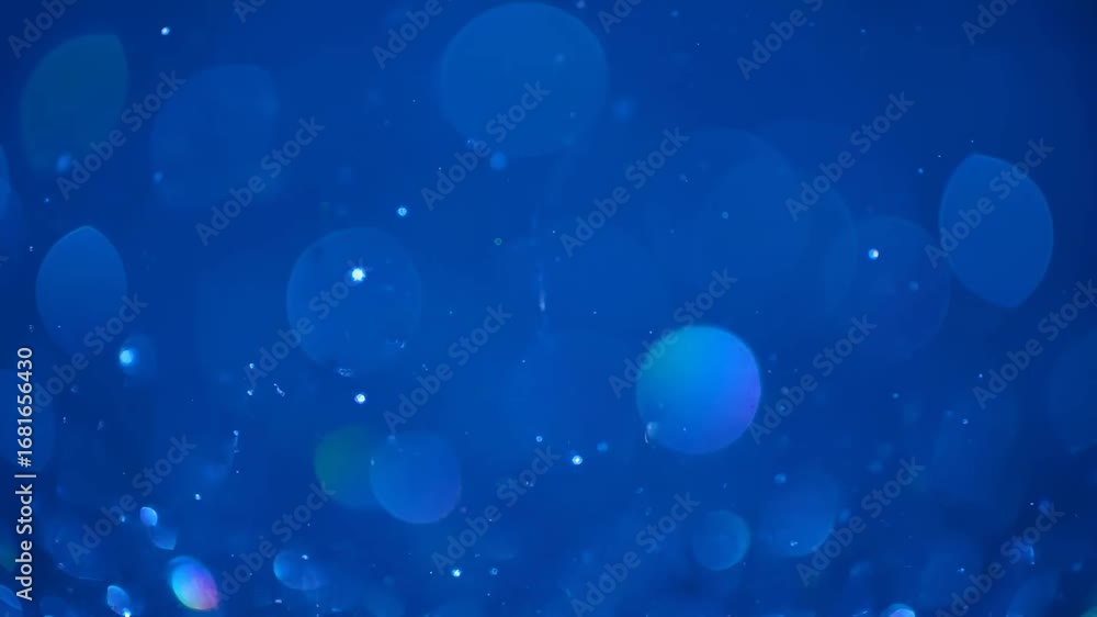 Poster abstract blue bokeh background - shimmering blue bokeh lights of varying sizes create a dreamy, abst