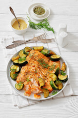 freshly baked salmon fillet with zucchini and dill