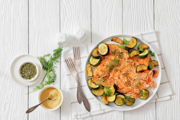 freshly baked salmon fillet with zucchini and dill