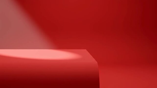 Red Product Display Podium - A corner of a red table or podium is illuminated by a spotlight against a matching red background.