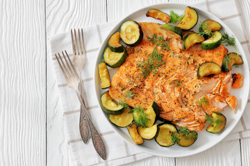 freshly baked salmon fillet with zucchini and dill