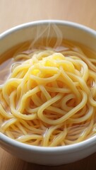 Delicious steaming hot ramen noodle soup with savory broth served in a white bowl perfect for a quick lunch or dinner asian cuisine
