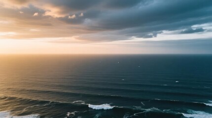 Fototapeta premium Ocean sunset, dramatic clouds. Wide-shot of waves