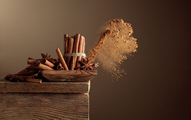 Cinnamon sticks and anise on a old wooden table.
