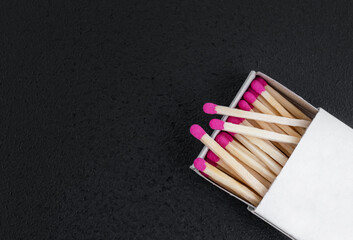Box with matches on a black. Close up. Top view. Copy space.