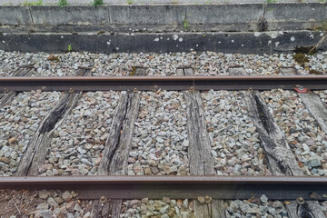 Rustic Railroad Track with Weathered Wood and Gravel Details for Transportation Design