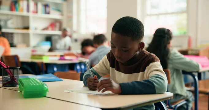 Boy, child and thinking with writing in classroom for test, problem solving and assessment for education. Kid, paper and notes with solution, learning and scholarship with development at school