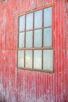 Fototapeta Aged red metal wall with window 