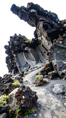 Fototapeta premium Dramatic volcanic rock formations, with a striking contrast of dark and light gray tones, create an awe-inspiring geological landscape.