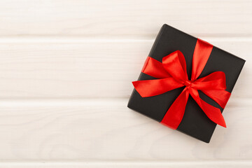 Black gift boxes on wooden background, top view. Black Friday concept