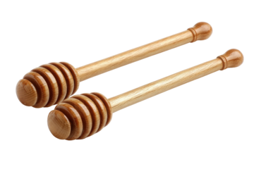 Two honey dippers, light-brown wooden, with a honeycomb pattern at the top