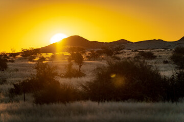 Beautiful Namibian Mountains Glowing in Golden Hour Sunset © Taskina