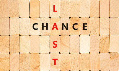 Last chance symbol. Concept word Last chance on beautiful wooden block wall. Beautiful wooden block...