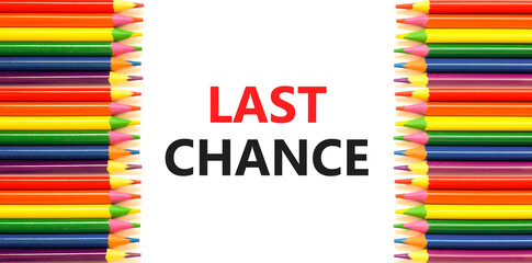 Last chance symbol. Concept word Last chance on beautiful white paper. Colored pencils. Beautiful...