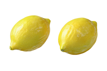 Two bright yellow lemons, slightly out of focus, on a black background